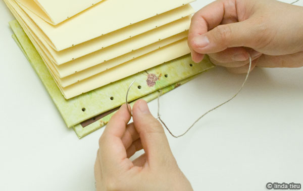 Sewing book using coptic stitch method