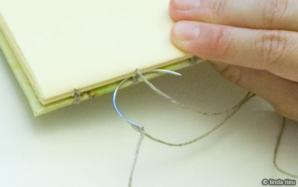 Detail of curved needle for kettle stitch